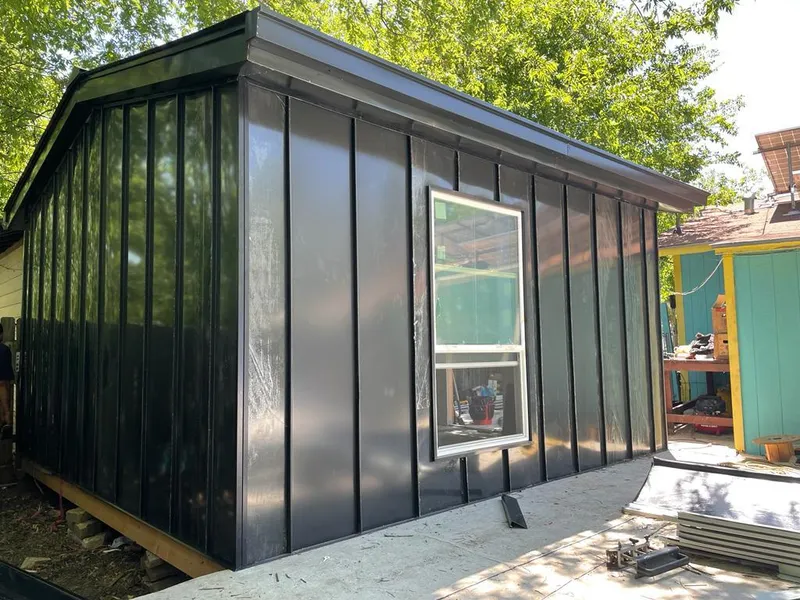 Black standing seam metal wall panels for Roof Inspection in Grand Forks