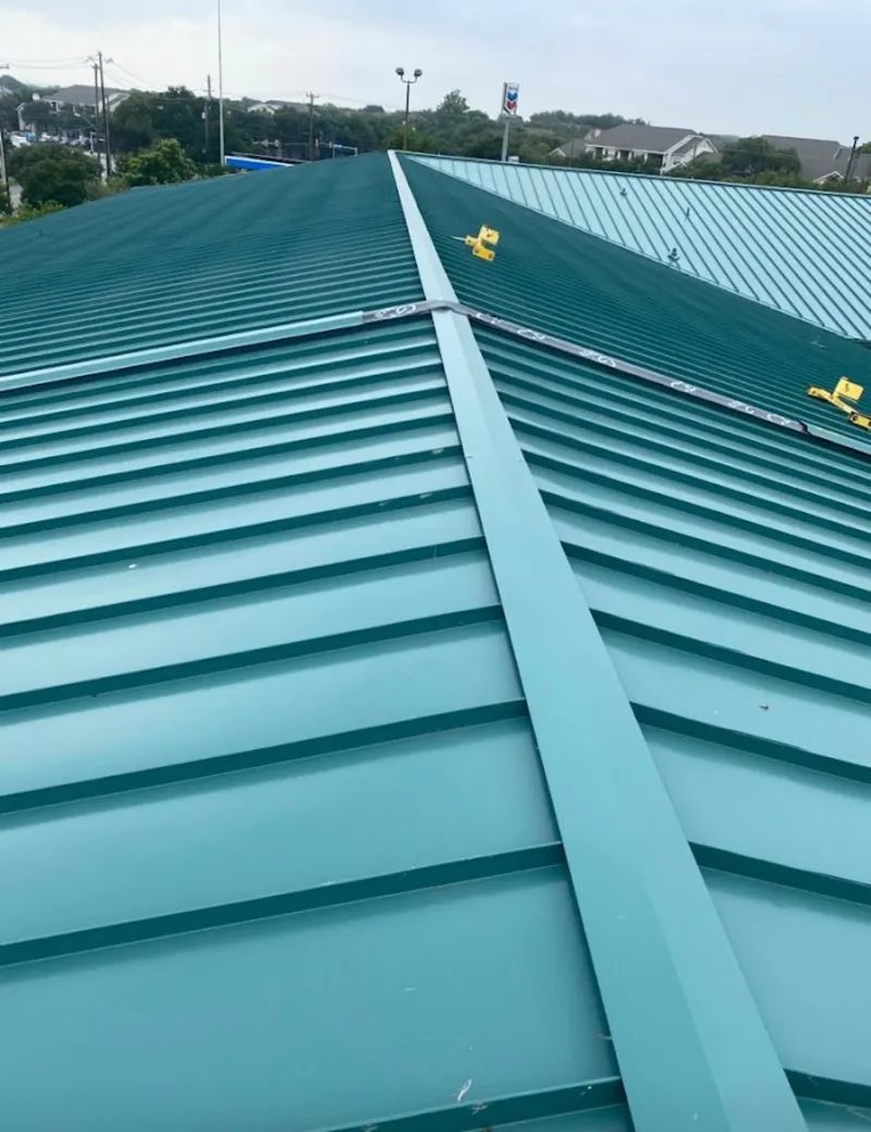 Green commercial metal roof ridge and valley for Metal Roof Repair in Grand Forks