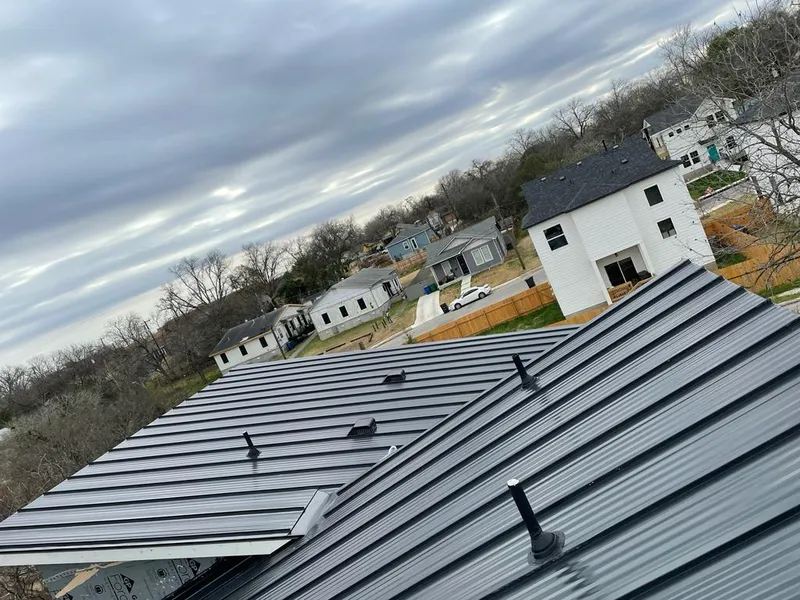 Standing seam metal roof panels with vents for Skylight Repair in Grand Forks